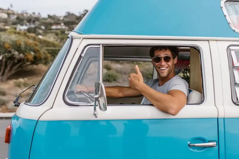 man inside of a car looking outside man inside of a car looking outside